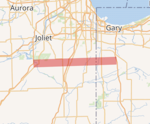 Map of northeastern Illinois and northwestern Indiana indicates a bold red line where the proposed Illiana highway would connect the two states, south of Joliet and Gary. 