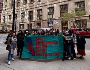 Advocates gather in front of Chicago's City Hall with a sign that reads Stop Environmental Racism on the Southwest Side