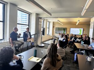 Rob Michaels and Mark Templeton speak to a group of attorneys in ELPC's conference room at the Midwest Environmental Litigators Conference