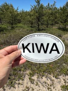 White round sticker reads "I got a lifer - kirtland's warbler KIWA www.michiganaudobon.org"